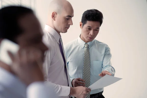 Mature Vietnamese Entrepreneur Showing Discussing Contract Details His Lawyer Coworker — Stock Photo, Image