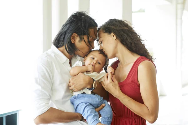 Young Parents Holding Little Son Arms Kissing Him Together — Stock Photo, Image