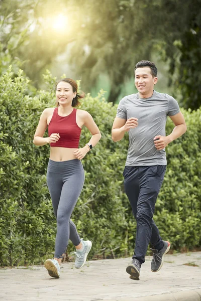 Happy Fit Young Asian Couple Sporty Clothes Running Together Sunny — Stock Photo, Image