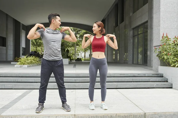 Cheerful Young Asian Couple Doing Exercises Warm — Stock Photo, Image