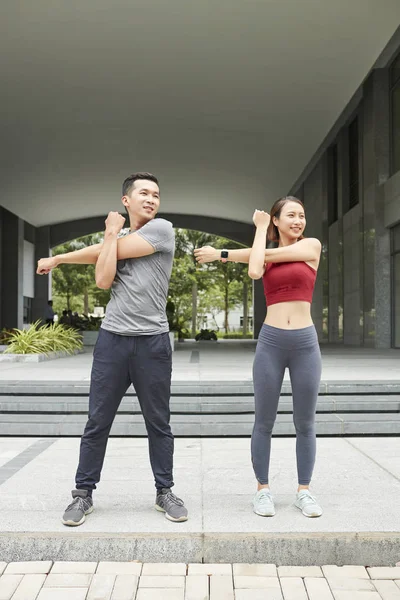 Cheerful Young Asian Man Woman Doing Exercise Stretch Arms — Stock Photo, Image