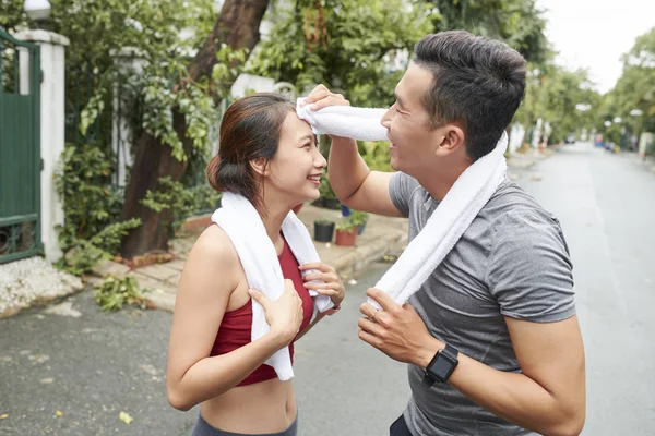 Fit Young Asian Man Wiping Sweat Forehead His Girlfriend Jogging — Stock Photo, Image