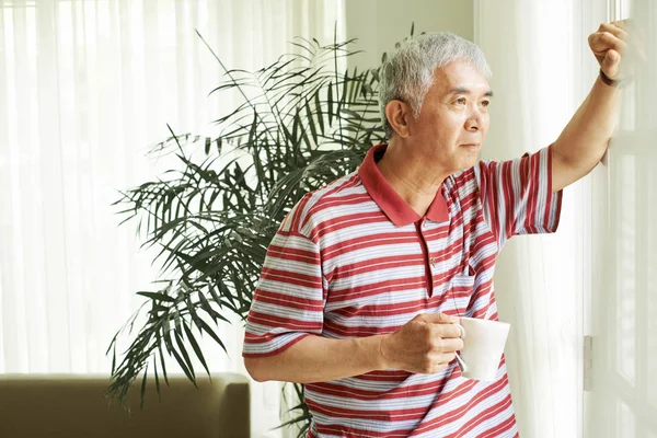 Asian Senior Man Looking View Window Pensive Expression While Drinking — Stock Photo, Image