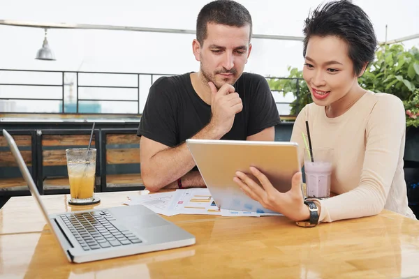 Multi Ethnic Business Couple Watching Online Conference Digital Tablet While — Stock Photo, Image