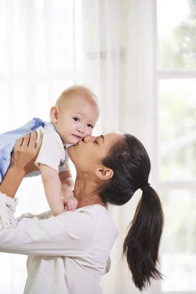 Happy Young Mixed Race Woman Lifting Her Small Son Kissing — Stock Photo, Image