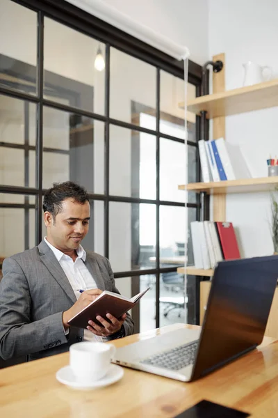 Indian Male Executive Working His Workplace Laptop Computer Writing Work — Stock Photo, Image