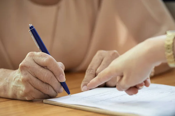 Close Mature Woman Sitting Table Putting Her Signature Document Pen — Stock Photo, Image