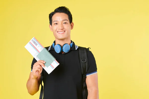 Positive Young Asian Man Headphones His Neck Showing Boarding Pass — Stock Photo, Image