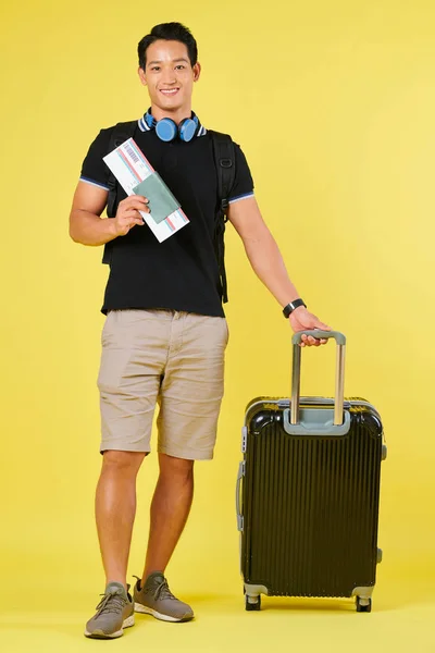 Smiling Vietnamese Plane Passenger Standing Suitcase Passports Ticket Isolated Yellow — Stock Photo, Image