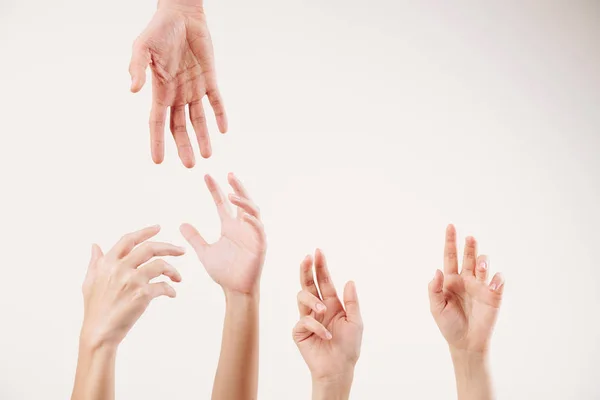 Close Young People Stretching Hands Supporting Each Other Isolated White — Stock Photo, Image