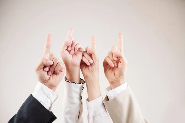 Close Business Team Raising Hands Together Pointing White Background — Stock Photo, Image