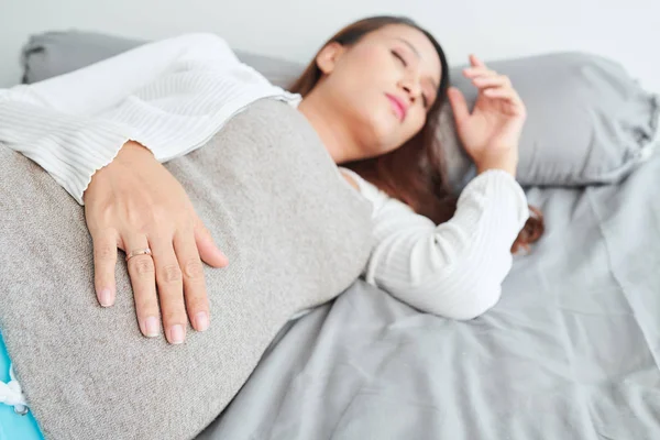 Unrecognizable Woman Wearing Gray Leggings Lying Cozy Bed Stock Photo by  ©DragonImages 213039484