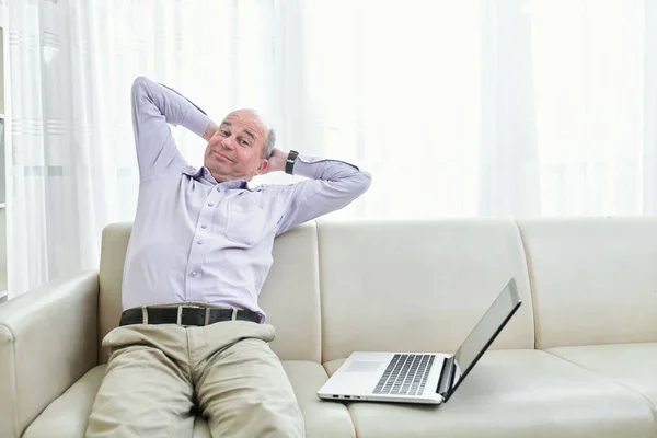 Smiling Lazy Middle Aged Man Sitting His Sofa Stretching Back — Stock Photo, Image