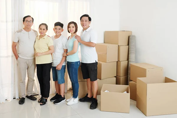 Happy Big Vietnamese Family Standing New House Full Cardboard Boxes — Stock Photo, Image