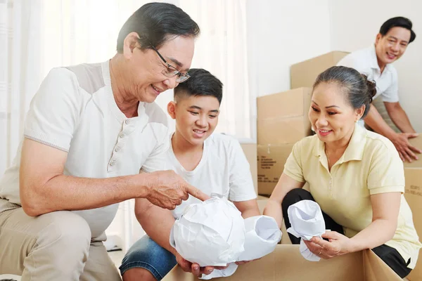 Cheerful Grandparents Explaining Boy How Wrap Fragile Things Packing Cardboard — Stock Photo, Image