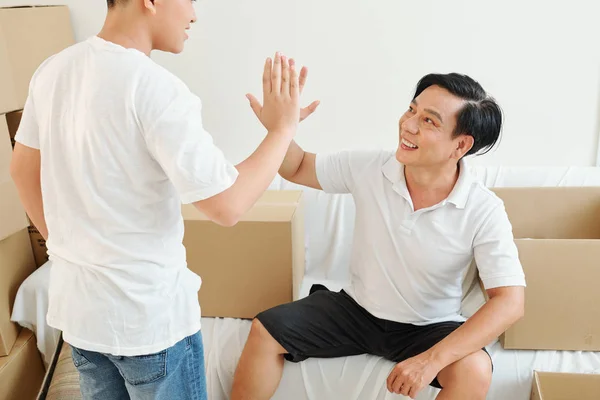 Smiling Mature Vietnamese Man Giving High Five His Teenage Son — Stock Photo, Image