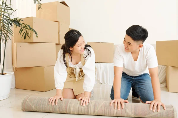 Smiling Asian Brother Sister Looking Each Other Unfolding Carpet Living — Stock Photo, Image