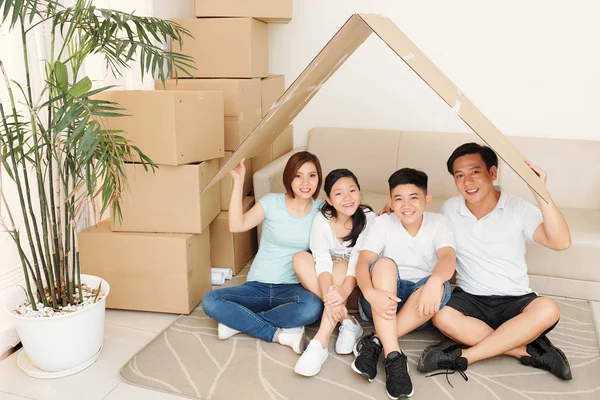 Positive Asian Family Sitting Floor New Apartment Roof Made Cardboard — Stock Photo, Image