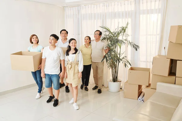 Cheerful Asian Family Entering New House Carrying Cardboard Boxes — Stock Photo, Image