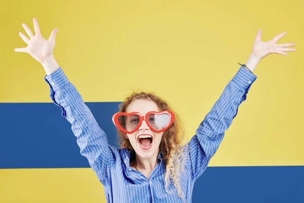 Pretty Happy Girl Heart Shaped Glasses Rising Arms Shouting Camera — Stock Photo, Image