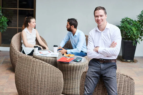 Portrait Confident Young Businessman Folding Arms Leaning Wicker Cafe Chair — Stock Photo, Image