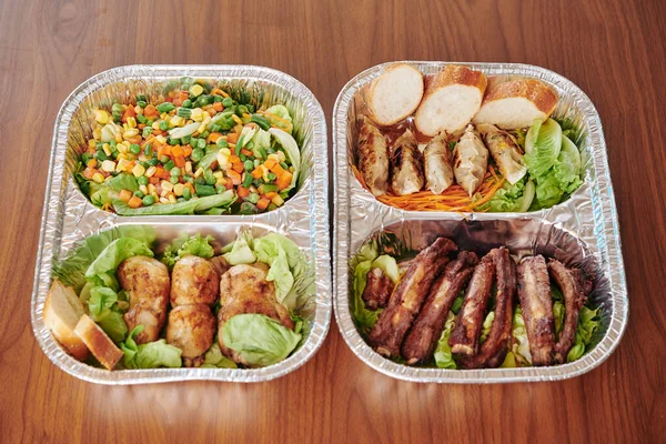 Foil containers with ready meals for a week ordered from local restaurant during coronavirus pandemic