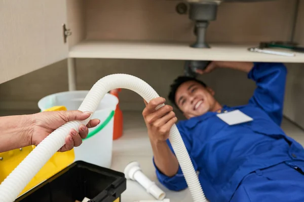 Hand Senior Woman Giving Plastic Pipe Plumber Fixing Leakage — Stock Photo, Image