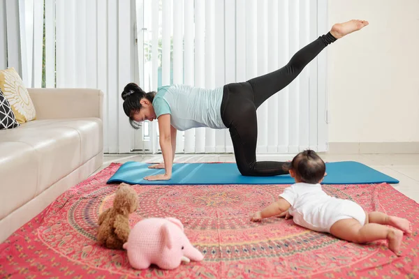 Mother and daughter doing yoga. woman and child training in the park.  outdoor sports. healthy sport lifestyle, chaturanga pose. well being,  mindfulness concept,watching video tutorial online on laptop 8497445 Stock  Photo at