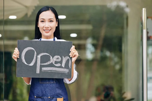 Portrait Cheerful Young Female Cafe Owner Showing Open Sign Written — Stock Photo, Image