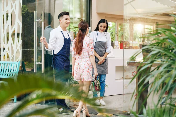 Cheerful Vietnamese Waiters Welcoming Client Inviting Cafe — Stock Photo, Image