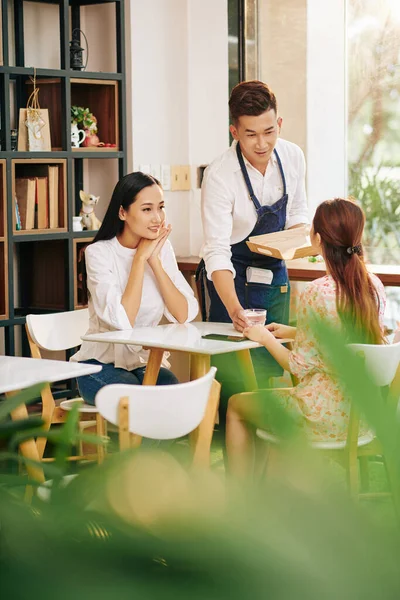 Young Vietnamese Waiter Bringing Glass Water Customers Taking Order — Stock Photo, Image