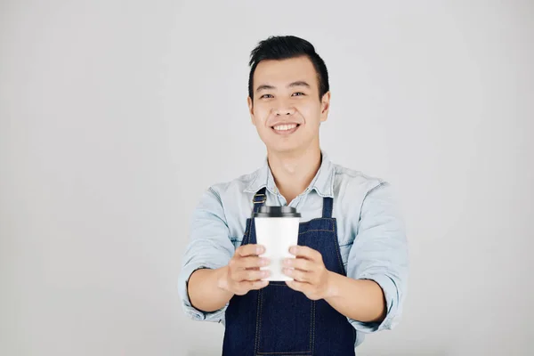 Cheerful Young Asian Barista Giving Cup Take Away Coffee Isolated — Stock Photo, Image