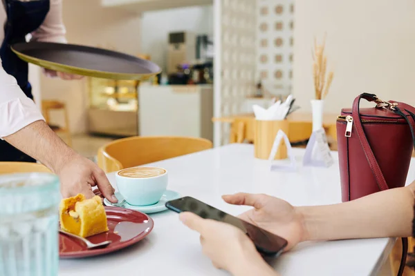 Waiter Putting Cup Coffee Delicious Dessert Cafe Table Front Customer — Stock Photo, Image