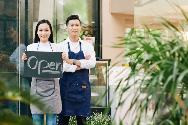 Cheerful Young Vietnamese Waiters Opening Cafe Quarantine Inviting Customers — Stock Photo, Image