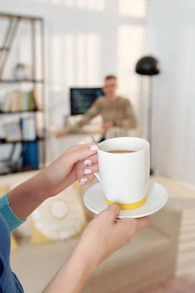 Hands Wife Bringing Cup Coffee Her Husband Who Working Computer — Stock Photo, Image
