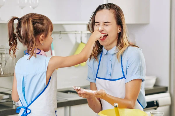Little Girl Touching Nose Her Laughing Mother Smudging Flour — Stock Photo, Image