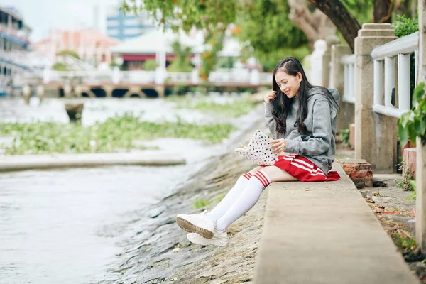 Positive Young Vietnamese Woman Spending Time River Bank Reading Interesting — Stock Photo, Image
