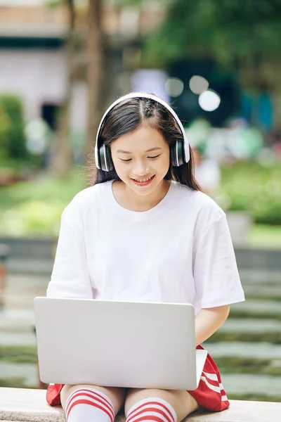 Smiling Asian Teenage Girl Headphones Sitting Park Working Laptop Programming — Stock Photo, Image