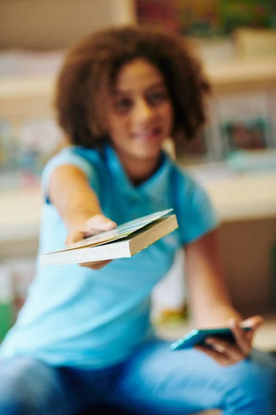 Curly Teenage Girl Outstretching Hands Book Camera Selective Focus — ストック写真