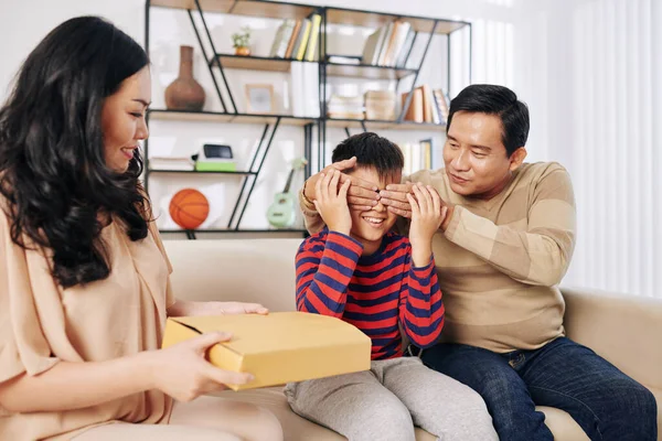 Father Covering Eyes Preteen Son Mother Giving Him Birthday Present — Stock Photo, Image