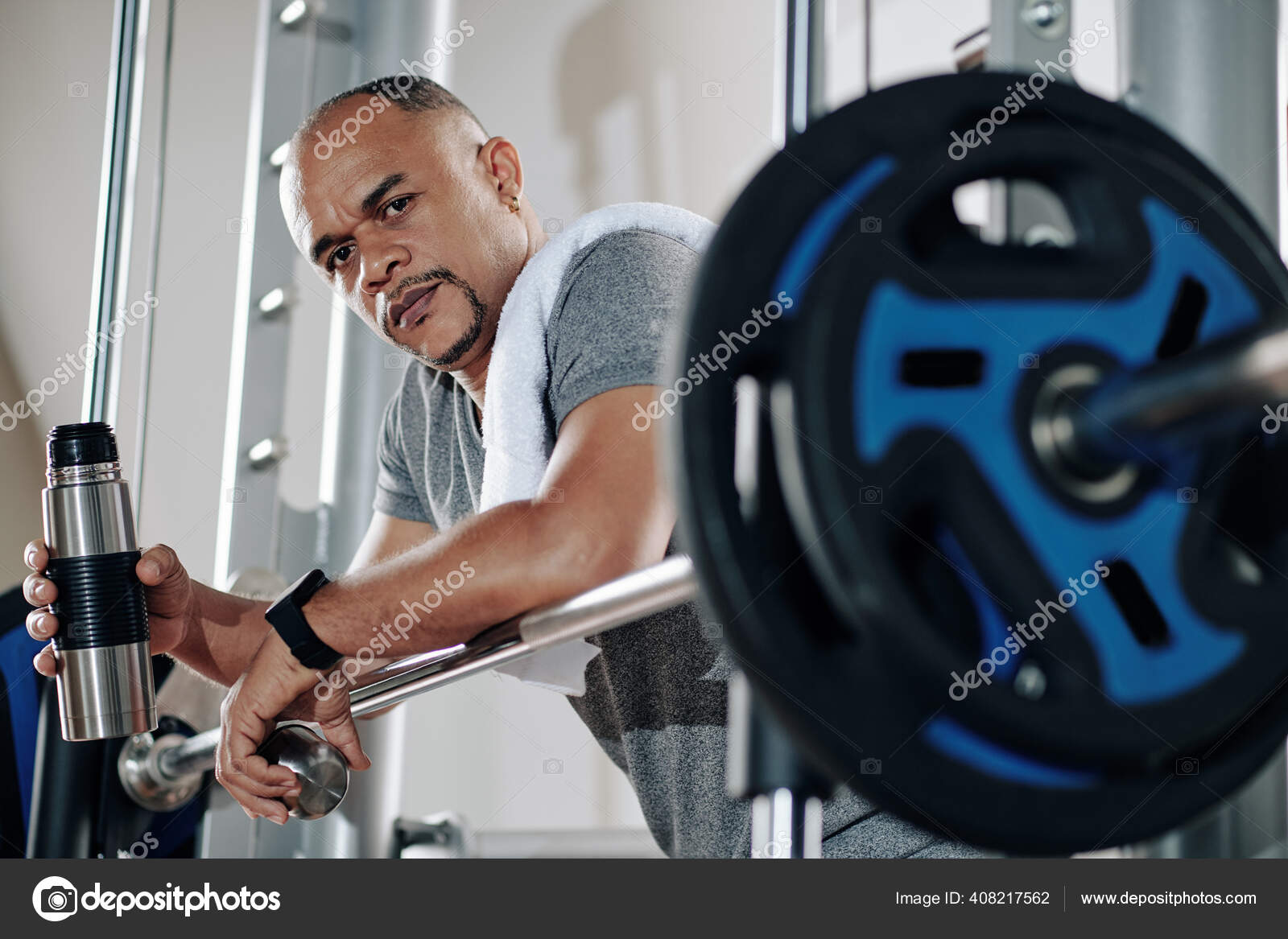 Frowning Serious Strong Man Leaning Barbell Resting Drinking Water