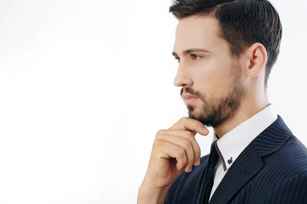 Retrato Joven Empresario Serio Pensativo Tocando Barbilla Mirando Delante Aislado — Foto de Stock