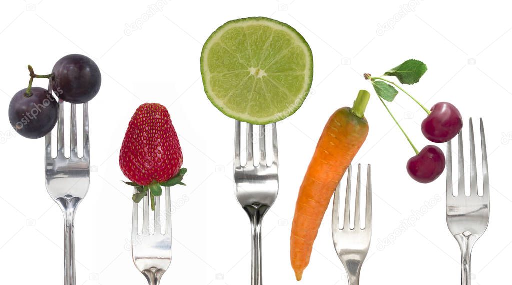 Diet concept, vegetables and fruit on the forks