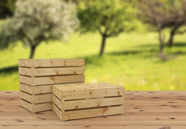 3D render of three wooden crates upside down for fruit or vegetable on wooden floor. On orchard background.