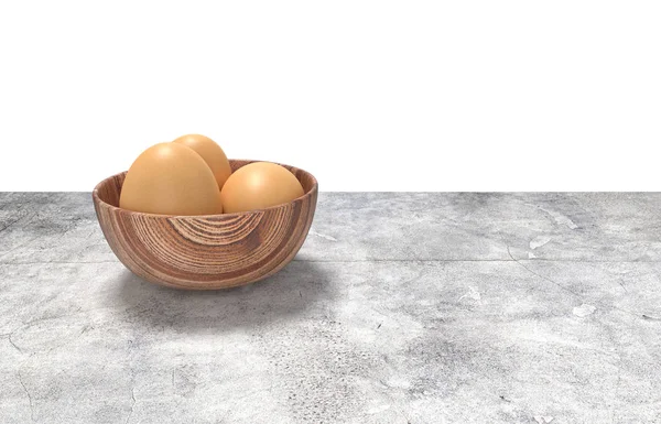Yumurta ahşap kase ful render. Beton masanın üzerine yerleştirilen.