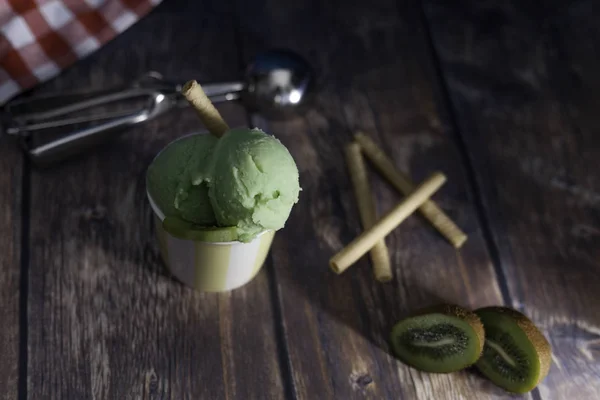 Kiwi ice-cream on wood table — Stock Photo, Image