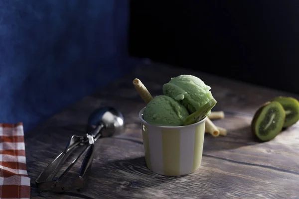 Kiwi ice-cream and spoon