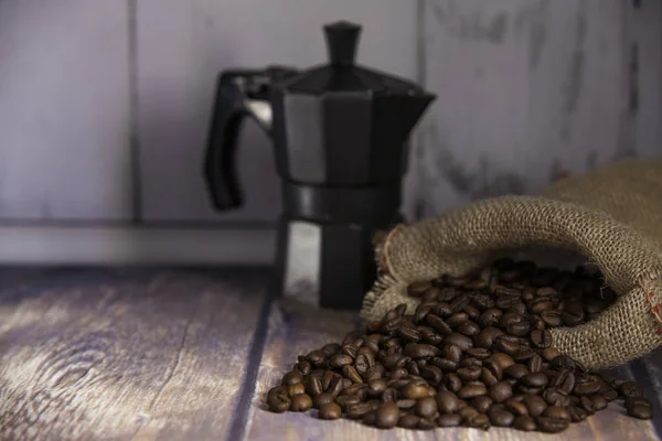 Coffee beans coming out of a sack — Stock Photo, Image