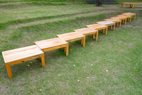 Picnic table row in garden