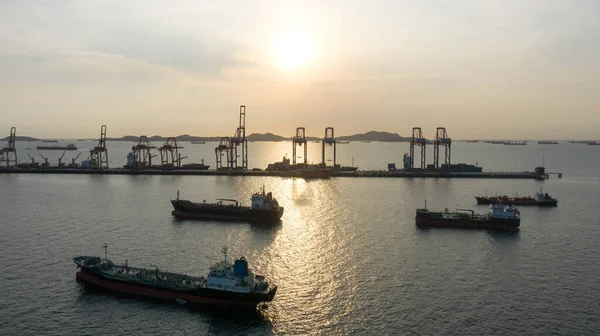 energy export and import business for transportation trade. Aerial top view of the ship carrying the LPG and oil tanker in the sea port with vessel global logistics